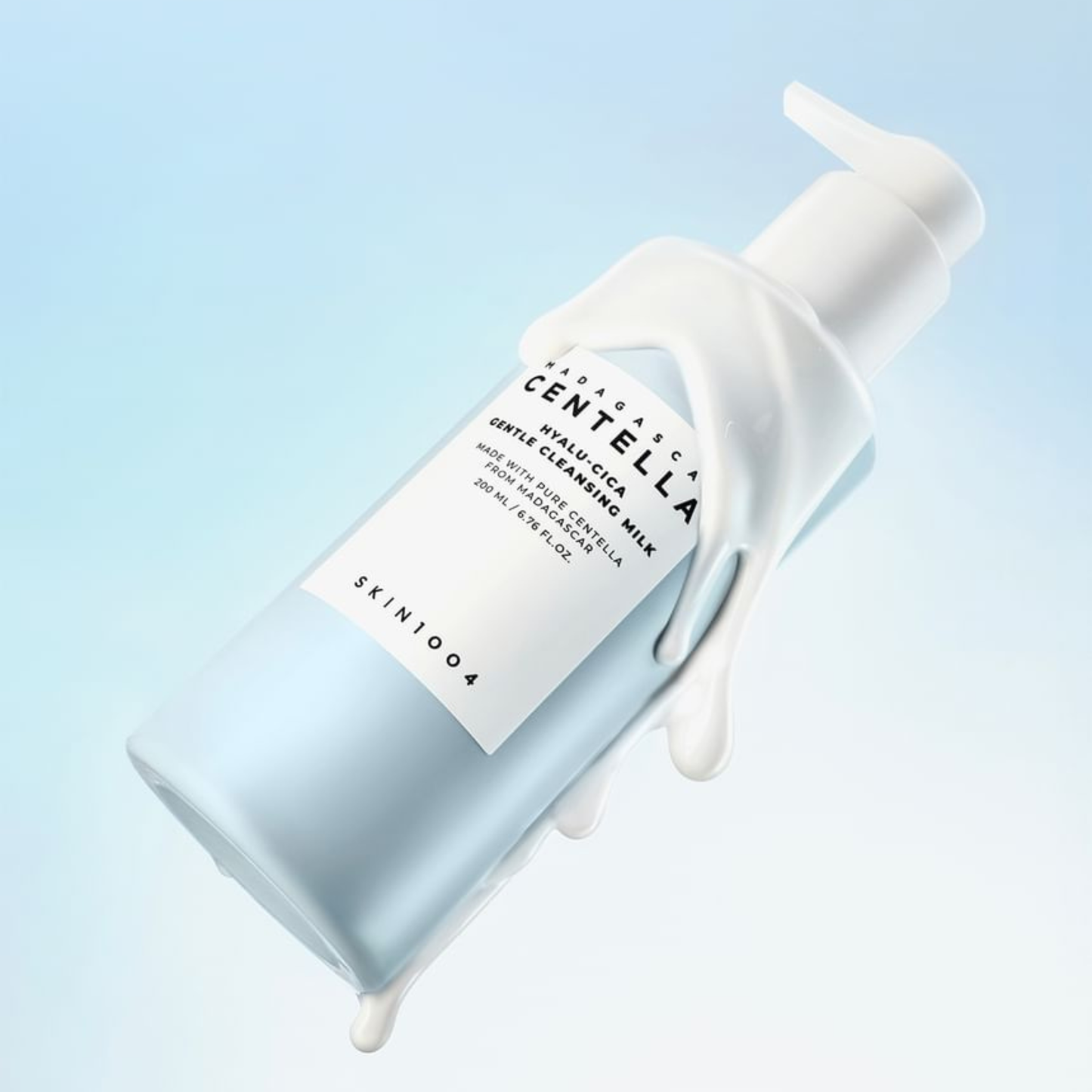 SKIN1004 Hyalu-Cica Blue Gentle Cleansing Milk bottle with white pump on a light blue background