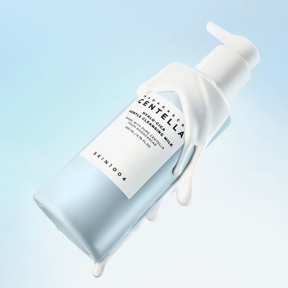 SKIN1004 Hyalu-Cica Blue Gentle Cleansing Milk bottle with white pump on a light blue background