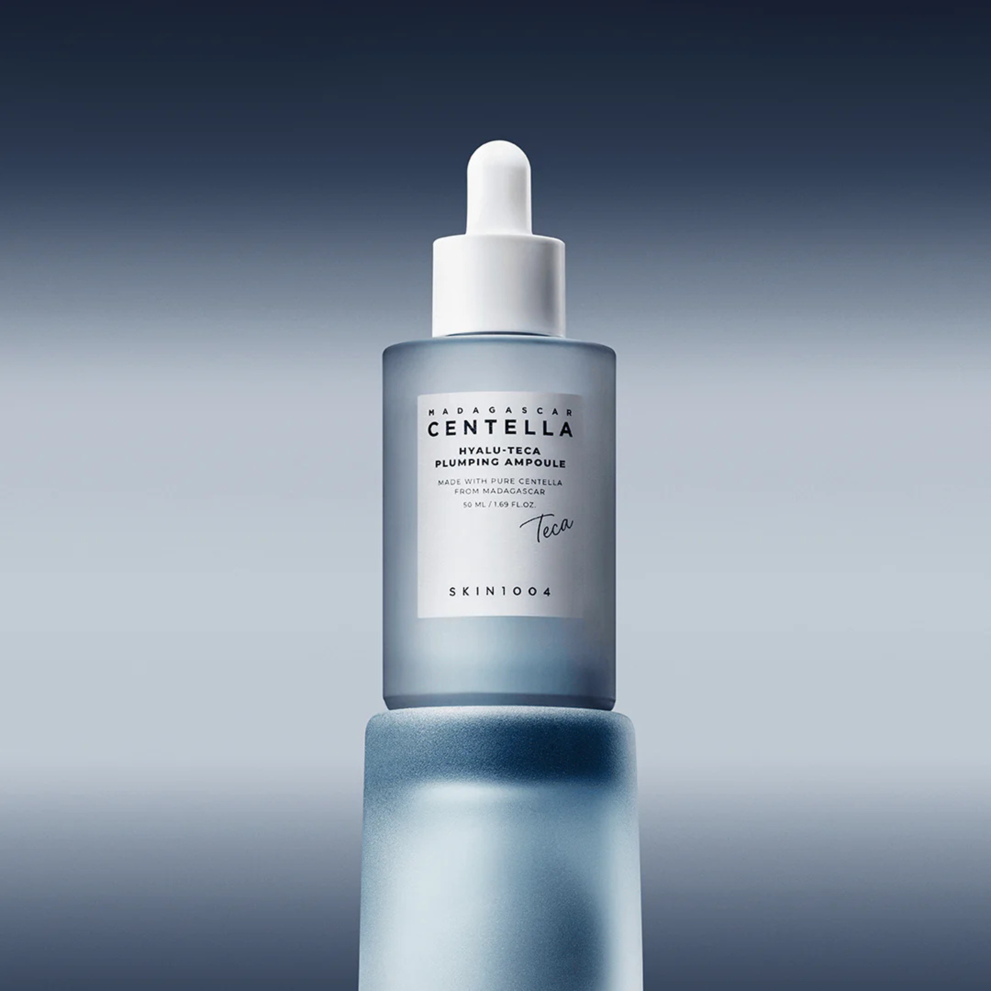 SKIN1004 Madagascar Centella Hyalu-Teca Plumping Ampoule on a blue background