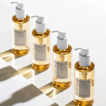 Four bottles of SKIN1004 Madagascar Centella Light Cleansing Oil on a light background
