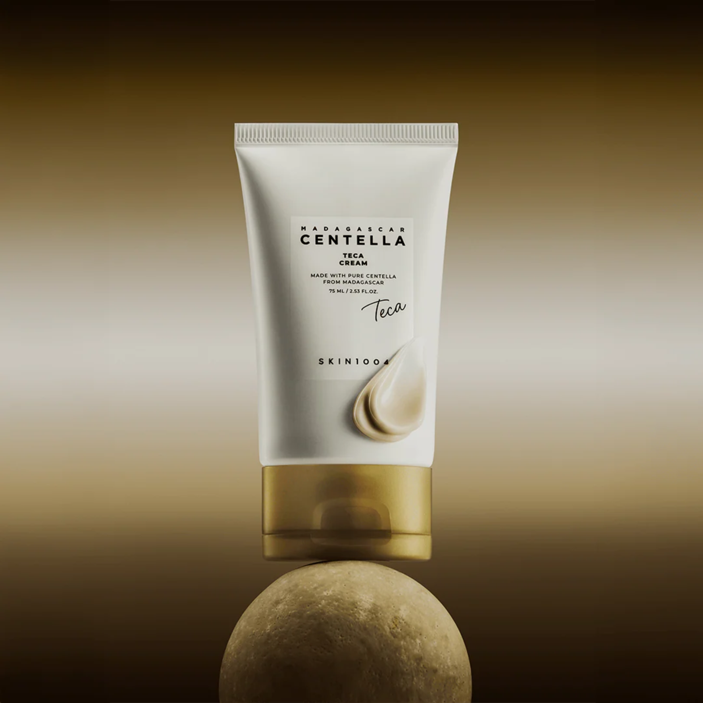 SKIN1004 Madagascar Centella Teca Cream lifestyle shot of tube balancing on a round rock