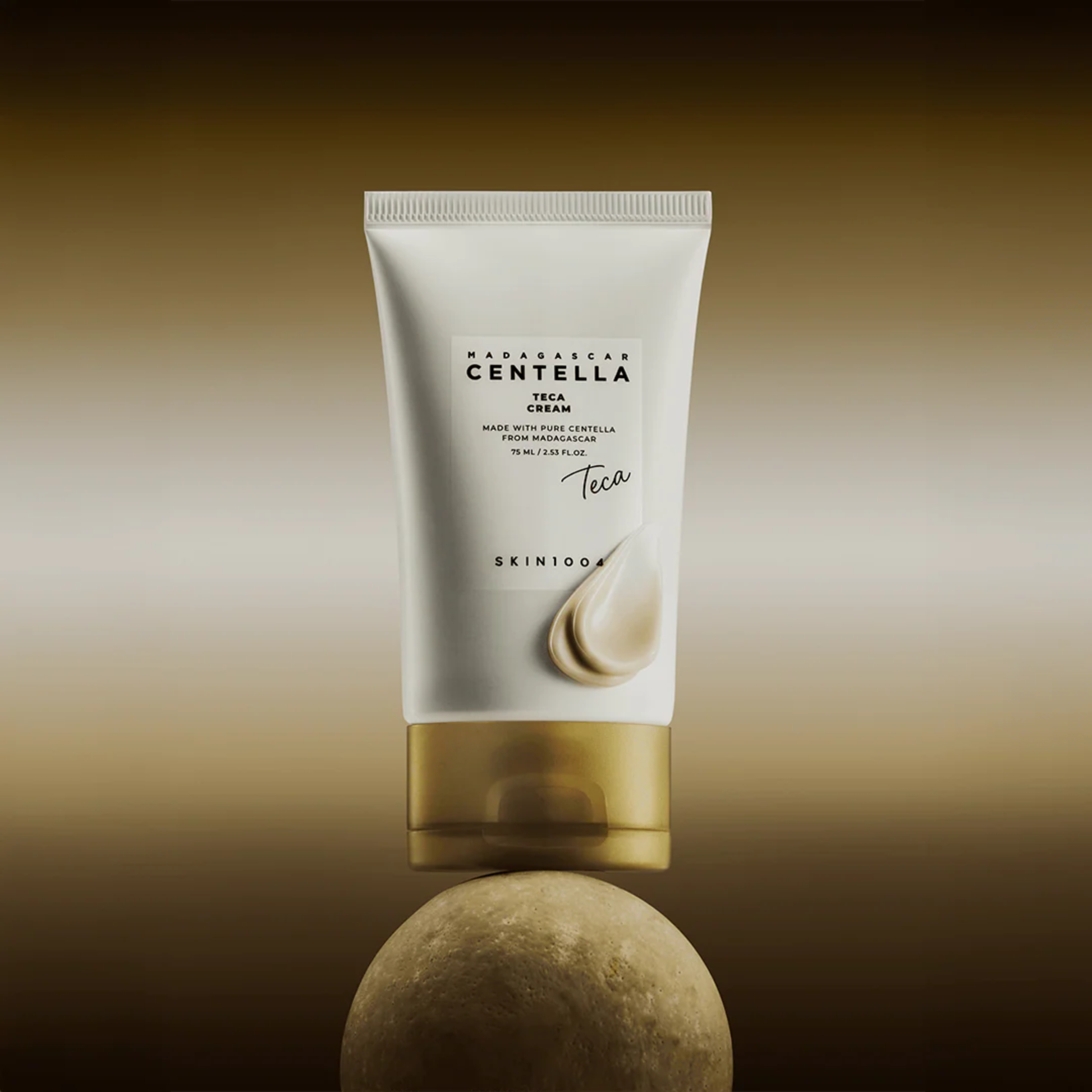 SKIN1004 Madagascar Centella Teca Cream lifestyle shot of tube balancing on a round rock