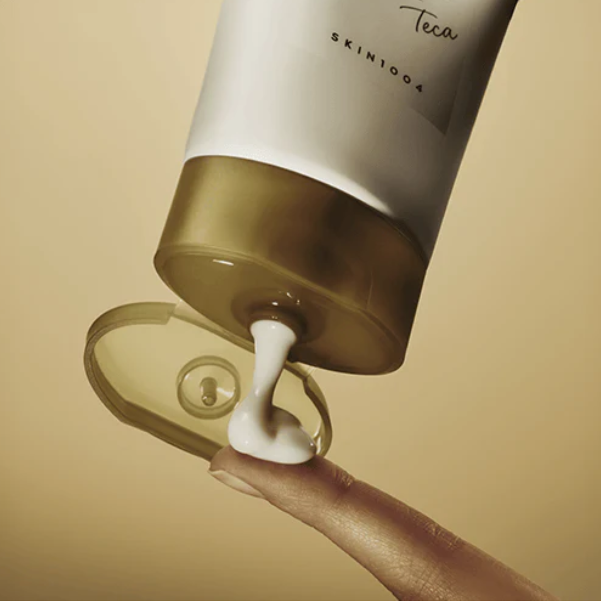 SKIN1004 Madagascar Centella Teca Cream being squeezed onto a finger