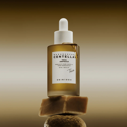 Lifestyle shot of the SKIN1004 Madagascar Centella Teca Ampoule balancing on some rocks