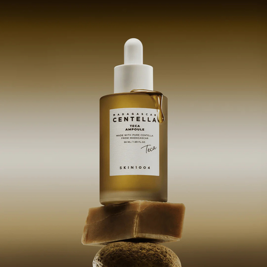 Lifestyle shot of the SKIN1004 Madagascar Centella Teca Ampoule balancing on some rocks