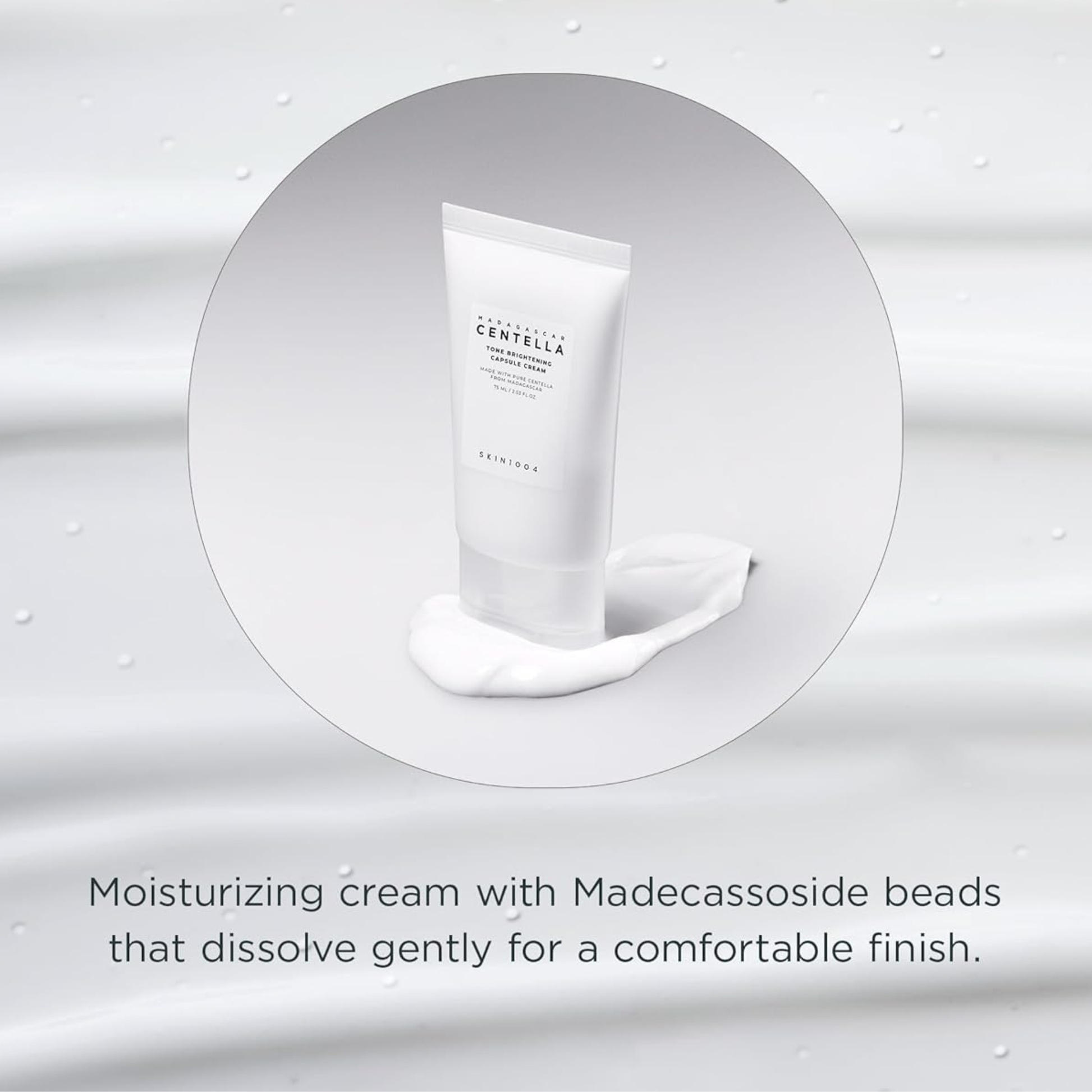 SKIN1004 Madagascar Centella Tone Brightening Capsule Cream sitting on top of cream. There is text about the Madecassoside beads that gently dissolve for a comfortable skin finish