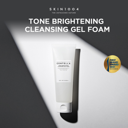 SKIN1004 Madagascar Centella Tone Brightening Cleansing Gel Foam on a dark background with brand name and product description.