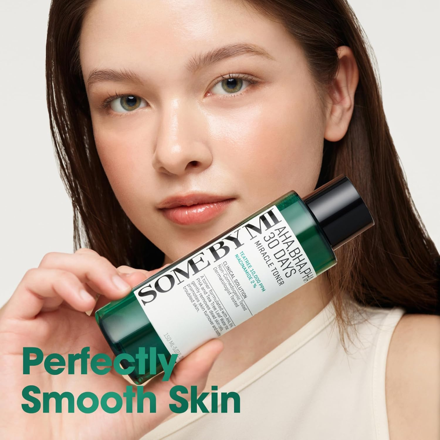 Woman holding SOME BY MI AHA BHA PHA 30 Days Miracle Toner with text saying Perfectly Smooth Skin