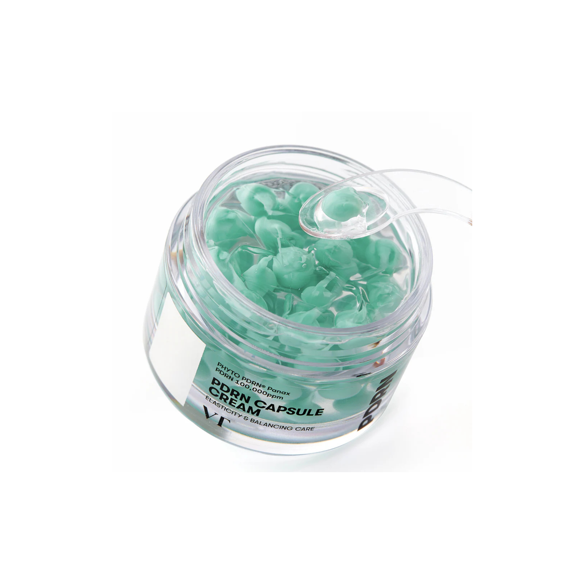 VT Cosmetics PDRN Capsule Cream 100 on a white background with a product scoop scooping a capsule from the jar