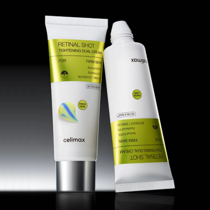 Two white cosmetic tubes of  Celimax The Vita-A Retinal Shot Tightening Dual Cream with lime green labels, displayed on a reflective black surface against a dark background.