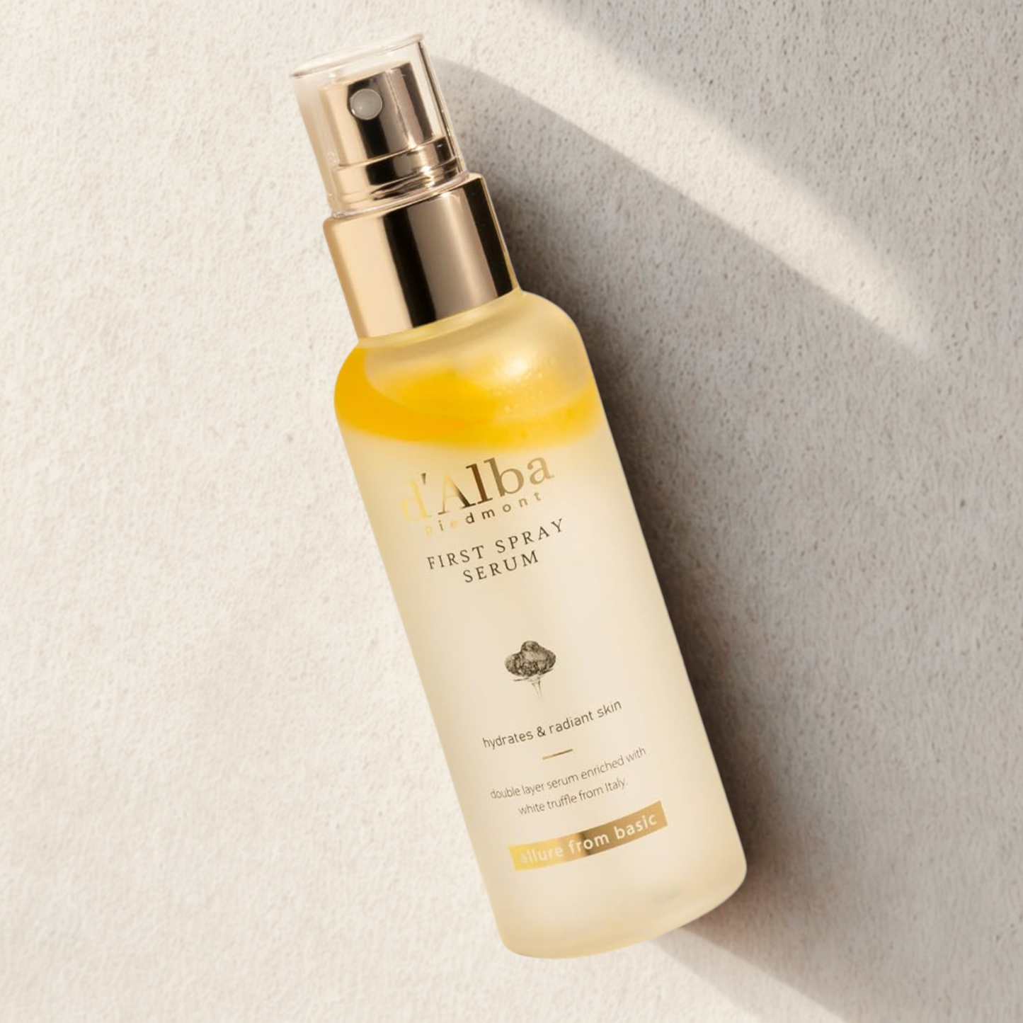 d’Alba White Truffle First Spray Serum on a natural stone background