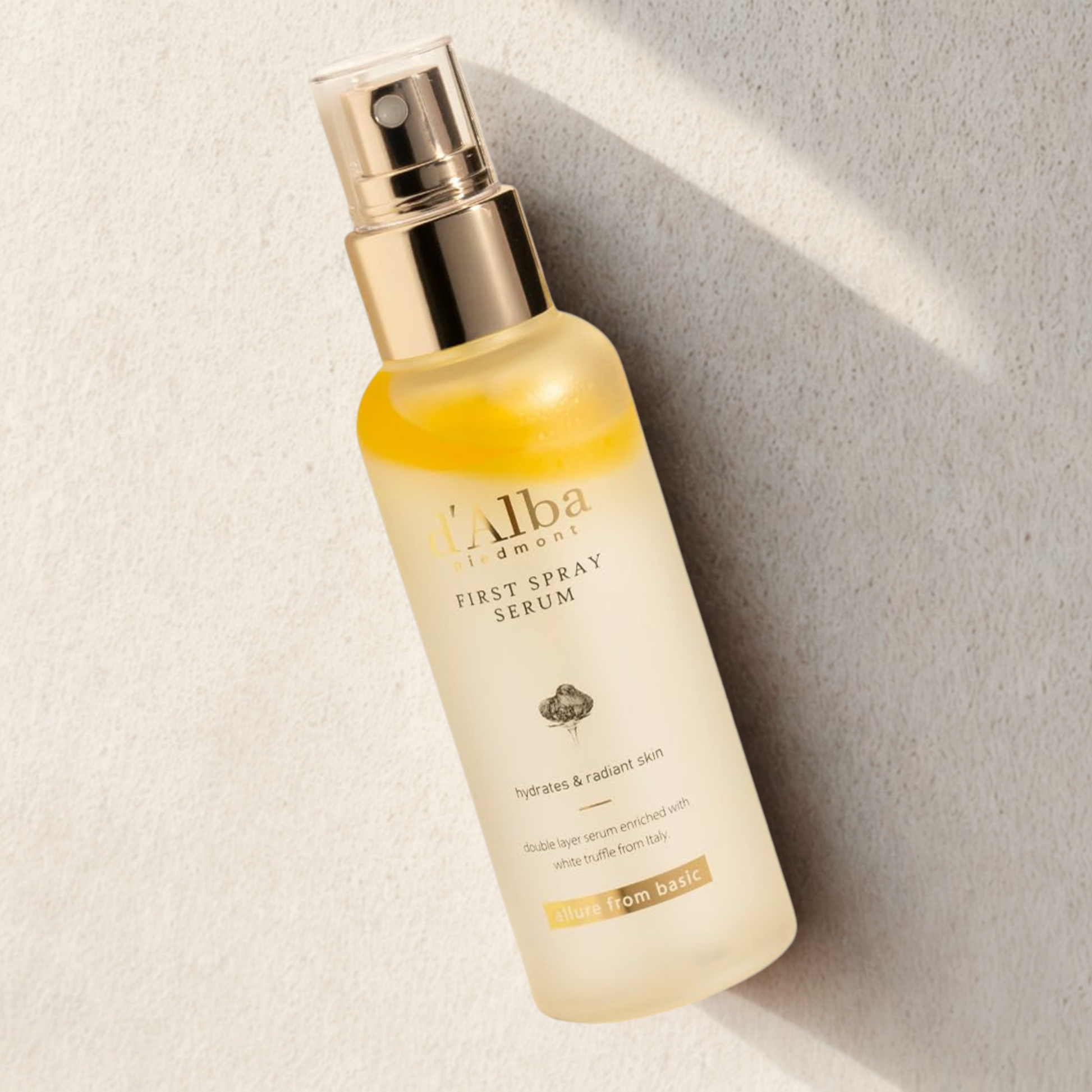 d’Alba White Truffle First Spray Serum on a natural stone background