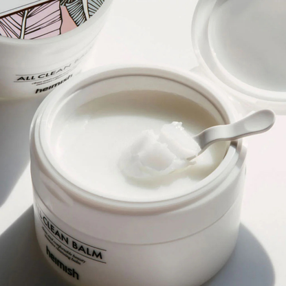 Open jar of heimish All Clean Balm with a spatula inside