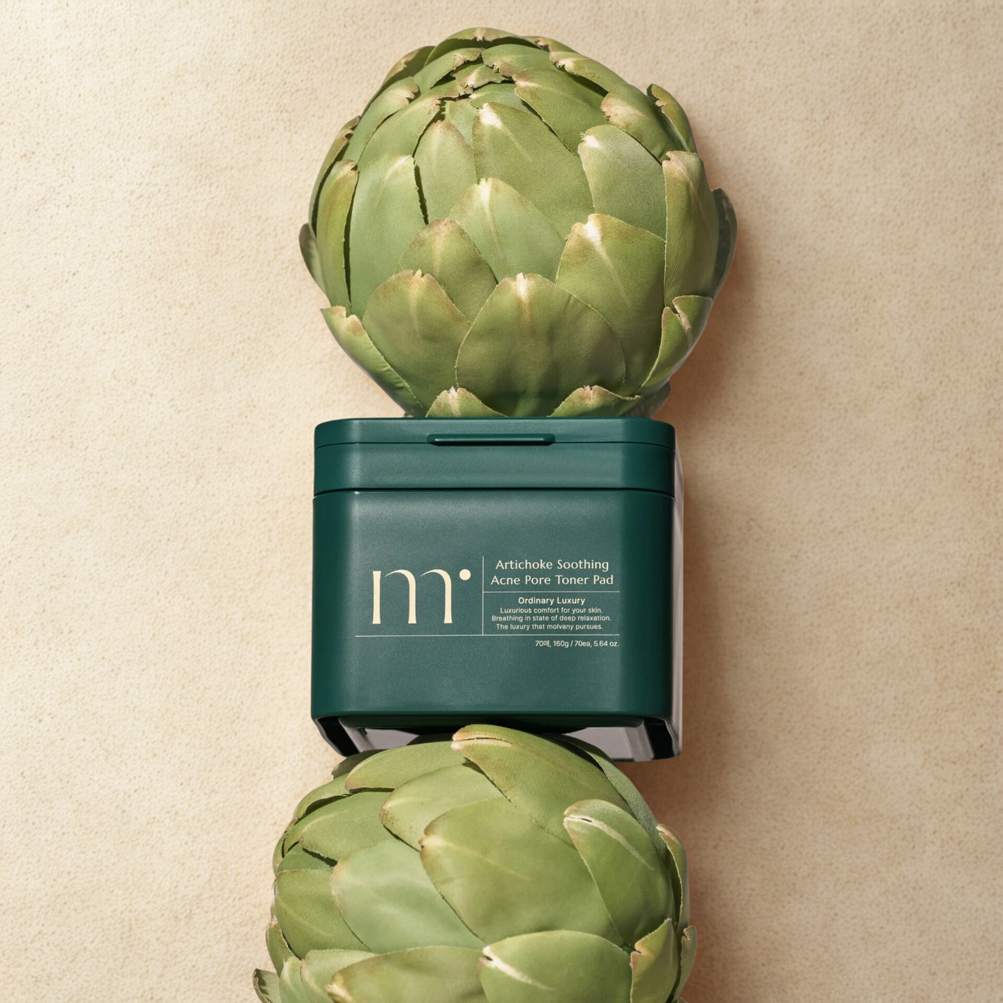 molvany Artichoke Soothing Acne Pore Toner Pads with artichokes on a beige background
