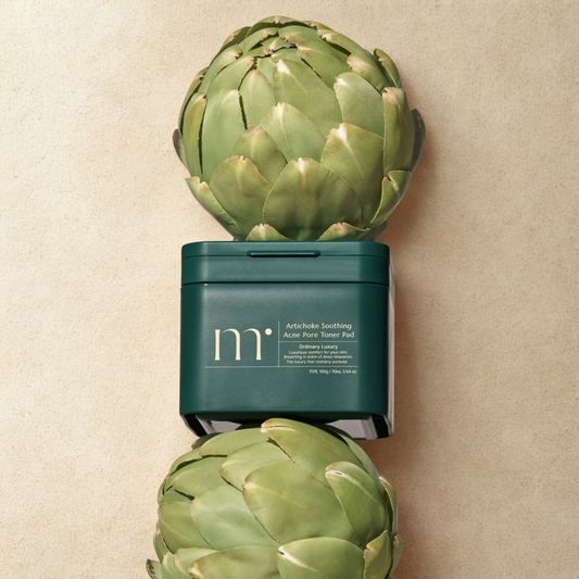 molvany Artichoke Soothing Acne Pore Toner Pads with artichokes on a beige background