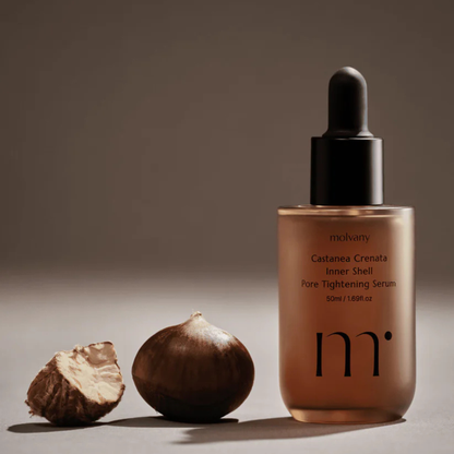 molvany Castanea Crenata Inner Shell Pore Tightening Serum serum bottle with a dried chestnut on a neutral background
