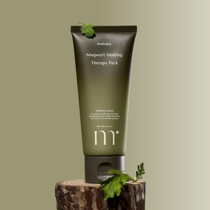 Molvany Mugwort Heating Therapy Pack on a wooden block with a green background